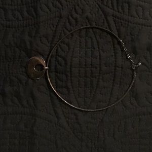 Choker length necklace with metallic circle